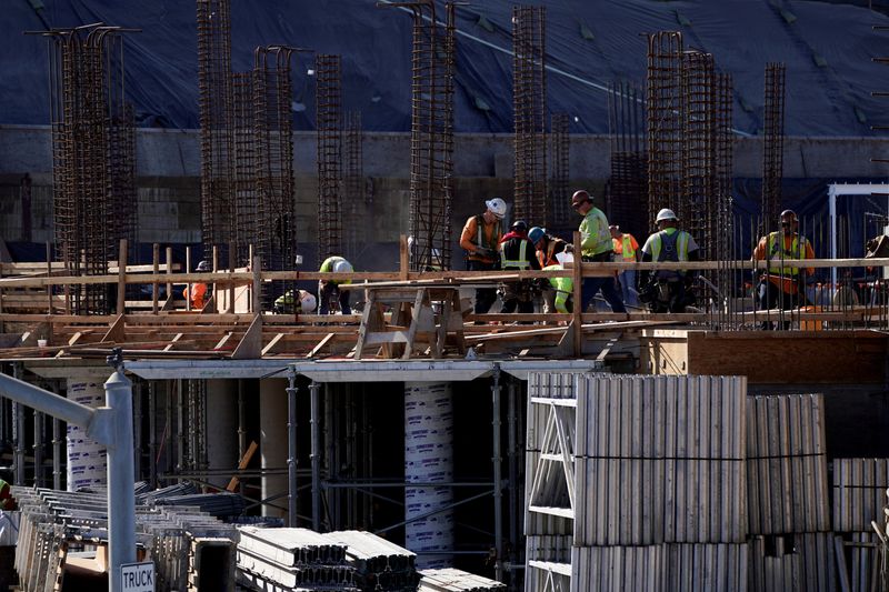 &copy; Reuters. FILE PHOTO: Work crews construct a new hotel complex on oceanfront property in Encinitas, California, U.S., November 26, 2019.   REUTERS/Mike Blake