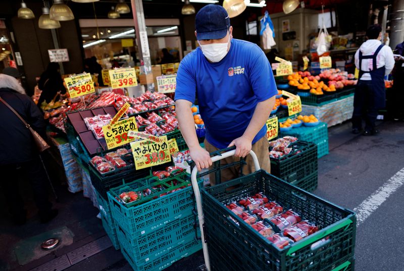 &copy; Reuters. FILE PHOTO-An employee of a supermarket named Akidai works at a store in Tokyo, Japan January 20, 2023. REUTERS/Issei Kato