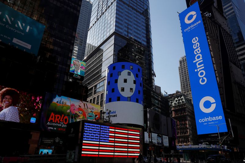 &copy; Reuters. The logo for Coinbase Global Inc, the biggest U.S. cryptocurrency exchange, is displayed on the Nasdaq MarketSite jumbotron and others at Times Square in New York, U.S., April 14, 2021. REUTERS/Shannon Stapleton