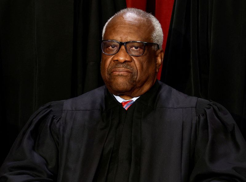 &copy; Reuters. FILE PHOTO: U.S. Supreme Court Associate Justice Clarence Thomas poses during a group portrait at the Supreme Court in Washington, U.S., October 7, 2022. REUTERS/Evelyn Hockstein