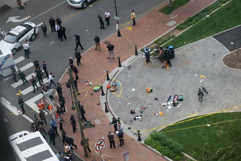 © Reuters. Law enforcement officers investigate at the scene after a gunman opened fire in a park as high school graduates and their families emerged from a theater where commencement exercises had just concluded, in Richmond, Virginia, U.S. June 6, 2023 in this picture obtained from social media. Clark Frierson/Instagram @by.esign/via REUTERS  