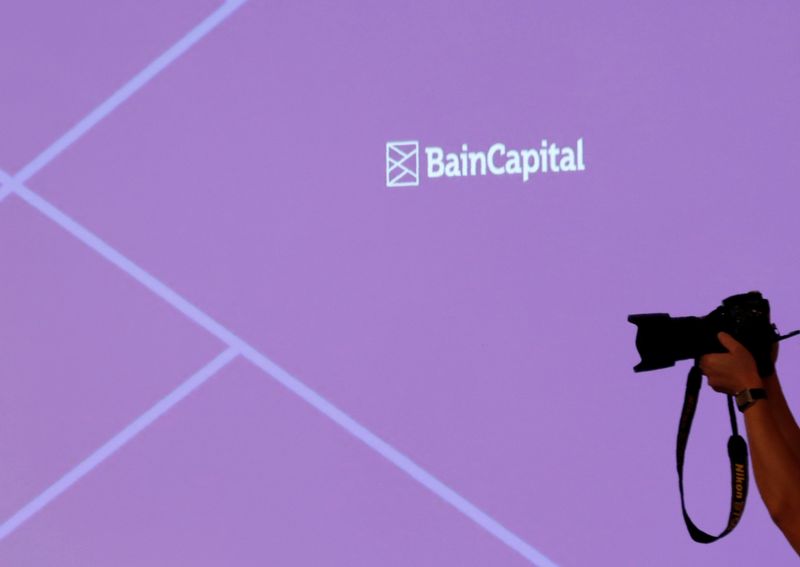 &copy; Reuters. The logo of Bain Capital is displayed on the screen during a news conference in Tokyo, Japan October 5, 2017. REUTERS/Kim Kyung-Hoon