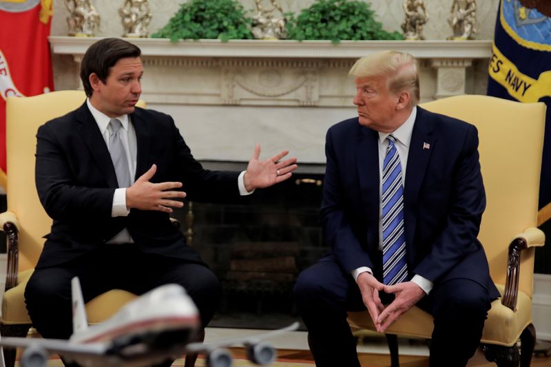 &copy; Reuters. FILE PHOTO: U.S. President Donald Trump listens to Florida Governor Ron DeSantis speak about the coronavirus response during a meeting in the Oval Office at the White House in Washington, U.S., April 28, 2020. REUTERS/Carlos Barria