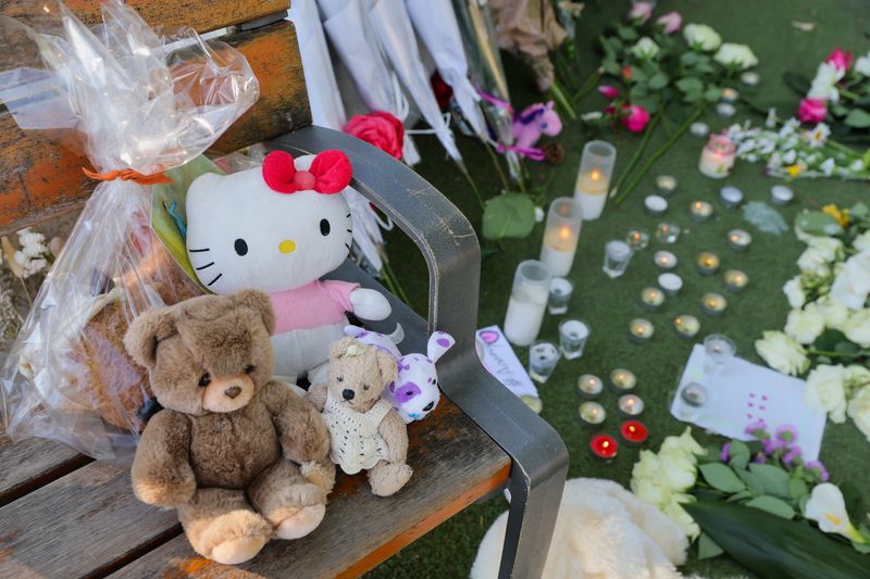 &copy; Reuters. A general view of flowers, candles and toys left at the Le Paquier park after several children and adults were injured in a knife attack, near the lake in Annecy, in the French Alps, France, June 9, 2023. REUTERS/Denis Balibouse
