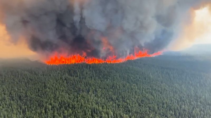 Wildfires spread in British Columbia, Quebec stops blaze from hitting hydro plants