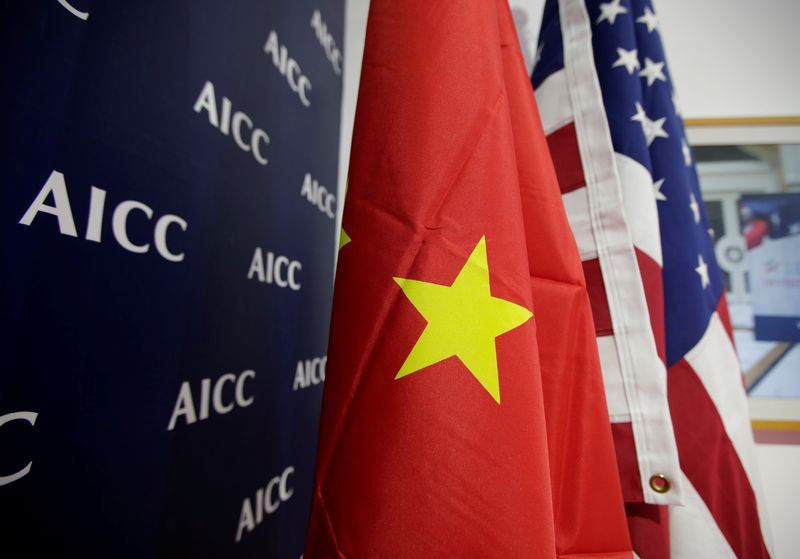 &copy; Reuters. FILE PHOTO: Flags of U.S. and China are displayed at American International Chamber of Commerce (AICC)'s booth during China International Fair for Trade in Services in Beijing, China, May 28, 2019. REUTERS/Jason Lee