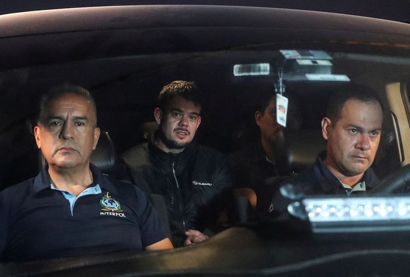 &copy; Reuters. FILE PHOTO: Dutch citizen Joran van der Sloot, who was serving a 28-year sentence in Peru after confessing to killing a 21-year-old Peruvian woman, is escorted to the airport to be extradited to the U.S., to face charges of extortion and wire fraud agains