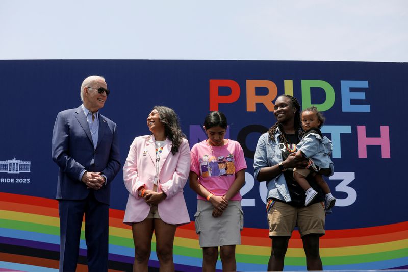 &copy; Reuters. U.S. President Joe Biden stands with the Harvey family as first lady Dr. Jill Biden delivers remarks during a Pride Celebration on the South Lawn of the White House, in Washington, U.S., June 10, 2023.  REUTERS/Anna Rose Layden