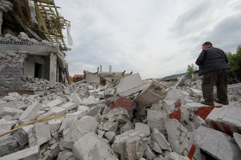 &copy; Reuters. A man stands on debris of a building heavily damaged by a Russian military strike, amid Russia's attack on Ukraine in Kharkiv region, Ukraine June 11, 2023. REUTERS/Vyacheslav Madiyevskyy