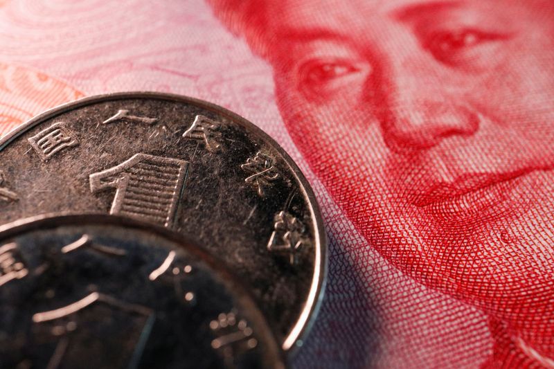 &copy; Reuters. FILE PHOTO: Coins and a banknote of China's yuan are seen in this illustration picture taken February 24, 2022. REUTERS/Florence Lo/Illustration