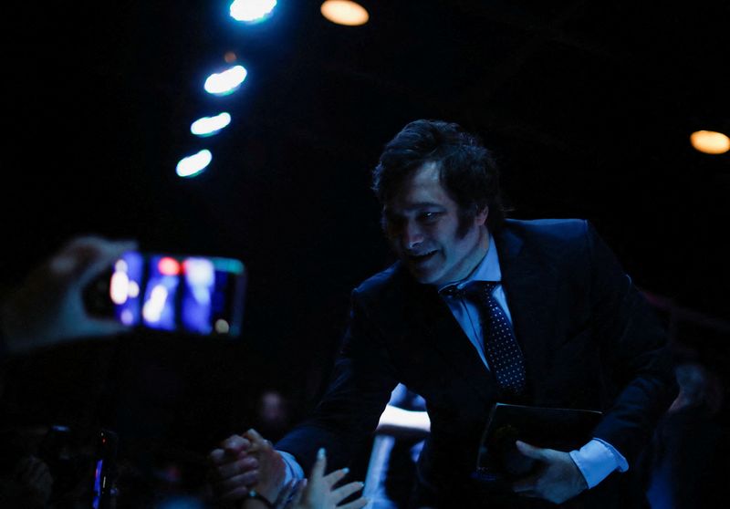 © Reuters. FILE PHOTO: Argentine congressman and presidential pre-candidate, Javier Milei, greets his supporters before the presentation of his book 