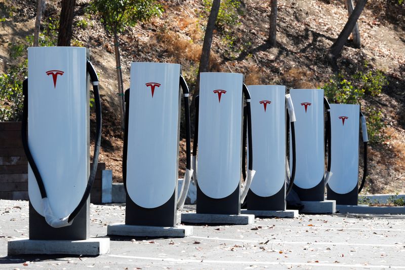 &copy; Reuters. FILE PHOTO: Newly installed car chargers at a Tesla Super Charging station are shown in Carlsbad, California, U.S. Sept. 14, 2018.        REUTERS/Mike Blake