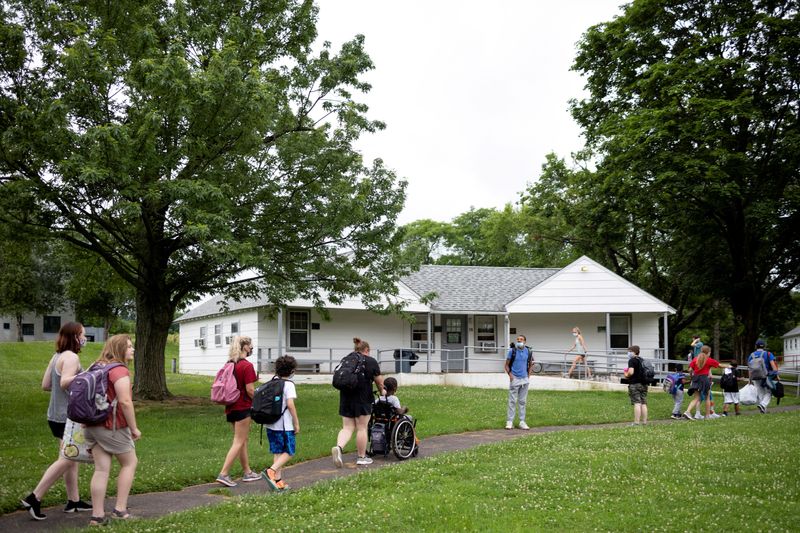 © Reuters. FILE PHOTO: Special needs children and their counselors walk to their morning activities as summer camp begins at Variety - the Children's Charity of the Delaware Valley in Worcester, Pennsylvania, U.S., June 21, 2021.  REUTERS/Hannah Beier/File Photo