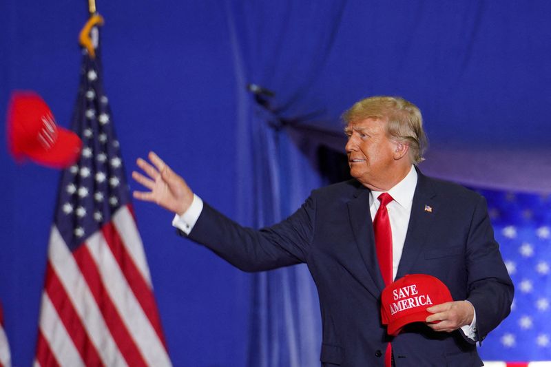 &copy; Reuters. FILE PHOTO: Former U.S. President Donald Trump throws a Save America cap as he attends a rally in Warren, Michigan, U.S., October 1, 2022.  REUTERS/Chery Dieu-Nalio/File Photo