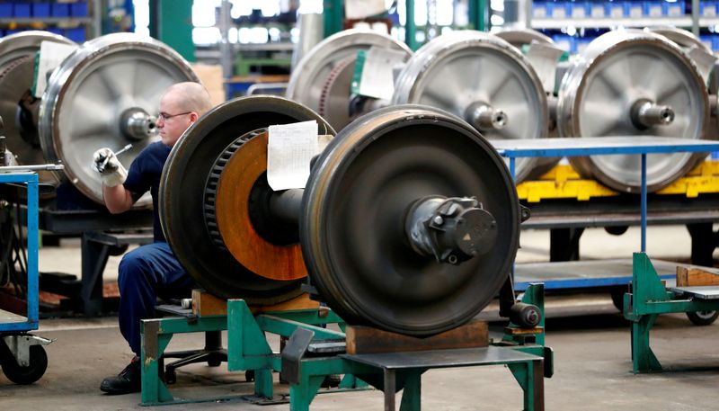 © Reuters. FILE PHOTO: A worker works on parts of S-Bahn commuter city train at German railway operator Deutsche Bahn's maintenance plant Schoeneweide in Berlin, Germany January 10, 2017. REUTERS/Fabrizio Bensch/File Photo        