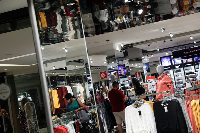 &copy; Reuters. People are seen at a store inside Nova America shopping mall, as malls reopen amid the coronavirus disease (COVID-19) outbreak, in Rio de Janeiro, Brazil, June 11, 2020. REUTERS/Ricardo Moraes