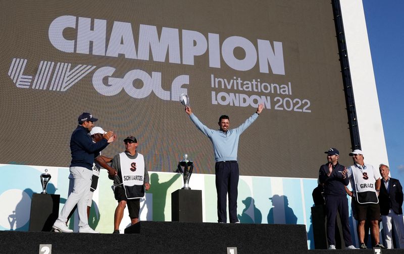 © Reuters. FILE PHOTO: Golf - The inaugural LIV Golf Invitational - Centurion Club, Hemel Hempstead, St Albans, Britain - June 11, 2022 South Africa's Charl Schwartzel of the Stinger team celebrates on the podium after winning The inaugural LIV Golf Invitational REUTERS/Paul Childs/File Photo