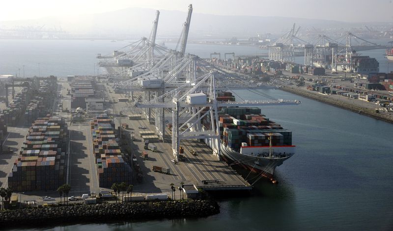 &copy; Reuters. FILE PHOTO: A container ship is docked at the Ports of Los Angeles and Long Beach, California in this aerial photo taken February 6, 2015. REUTERS/Bob Riha Jr/File Photo