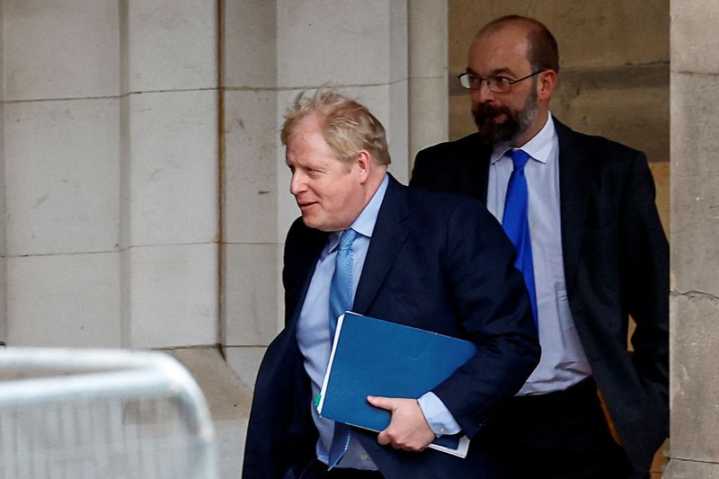 &copy; Reuters. Former British Prime Minister Boris Johnson walks at the parliament in London, Britain, March 22, 2023. REUTERS/Peter Nicholls