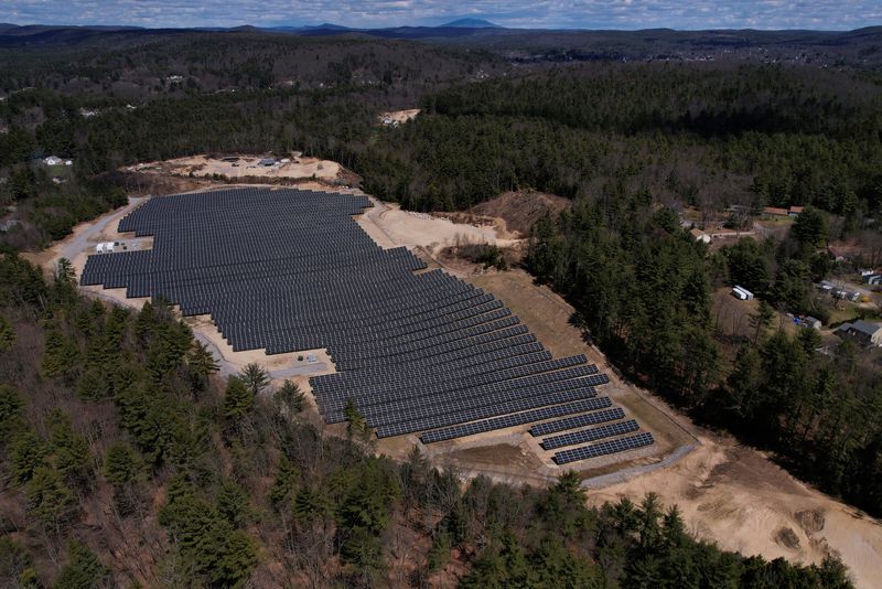 &copy; Reuters. FILE PHOTO: Solar panels are arrayed on Earth Day in Athol, Massachusetts, U.S., April 22, 2022. Picture taken with a drone.     REUTERS/Brian Snyder/File Photo