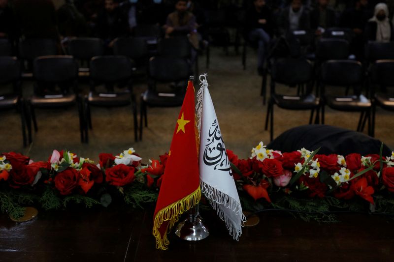 &copy; Reuters. The flags of the China and the Islamic Emirate of Afghanistan are displayed during a news conference held by Afghan Deputy Prime Minister Mullah Abdul Ghani Baradar and Wang Yu, China's ambassador in Afghanistan, in Kabul, Afghanistan, January 5, 2023. RE