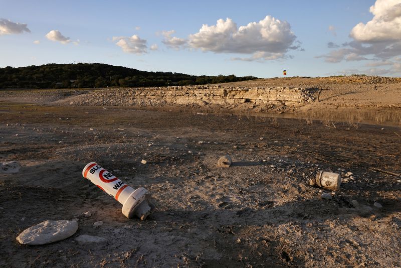 &copy; Reuters. FILE PHOTO: A bouy normally used to mark "No wake" zones sits on dry land at Medina Lake outside of San Antonio as majority of Texas experiences drought amid an extreme heat wave hitting the state, in Medina County, Texas, U.S., June 18, 2022. REUTERS/Jor