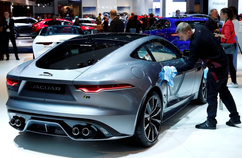 &copy; Reuters. FILE PHOTO: A worker cleans a new Jaguar F-Type model at Brussels Motor Show, Belgium, January 9, 2020. REUTERS/Francois Lenoir/File Photo