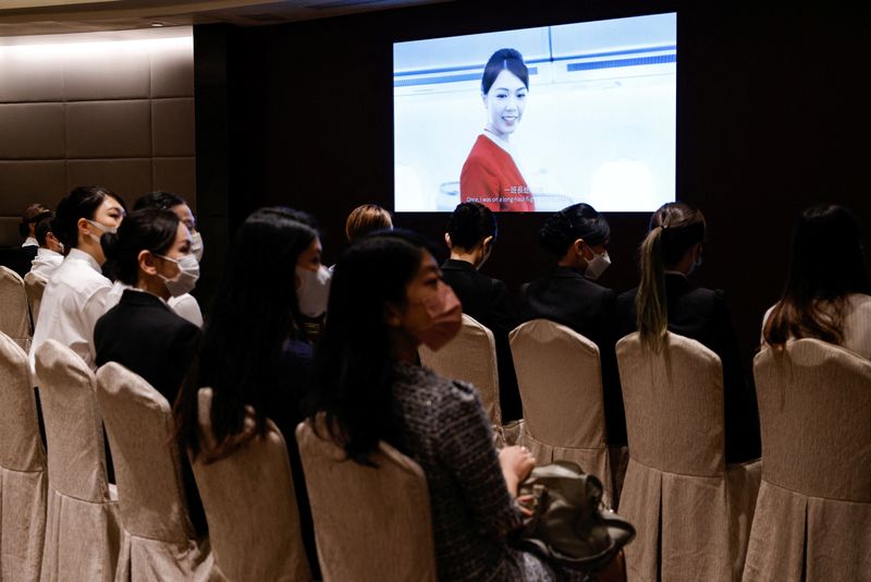 &copy; Reuters. Applicants sit in a waiting room during the Cathay Pacific's flight attendants recruitment day, first time since the COVID-19 pandemic, in Hong Kong, China October 7, 2022. REUTERS/Tyrone Siu/File photo