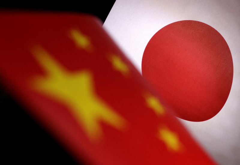 &copy; Reuters. FILE PHOTO: Printed Chinese and Japanese flags are seen in this illustration, July 21, 2022. REUTERS/Dado Ruvic/Illustration/File Photo