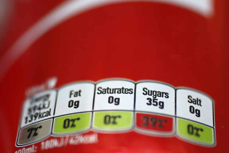 © Reuters. FILE PHOTO: A detail of a can of Coca-Cola is seen in London, Britain March 16, 2016. Britain will introduce a sugar levy on soft drinks in two years' time to tackle a growing obesity crisis, finance minister George Osborne said in a surprise announcement on Wednesday, hitting share prices in drinks and sugar firms.  REUTERS/Stefan Wermuth/File Photo