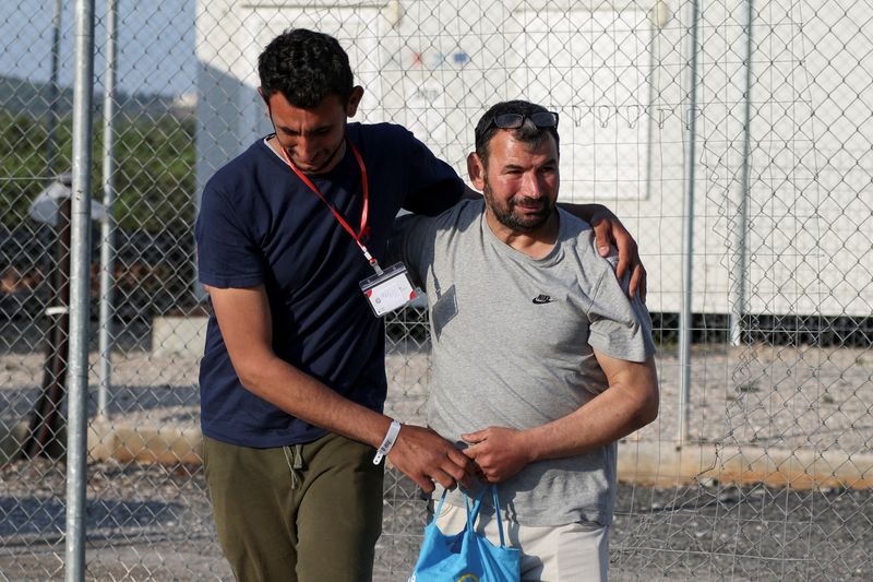 With scores missing from shipwreck, family members flock to Greek migrant camp