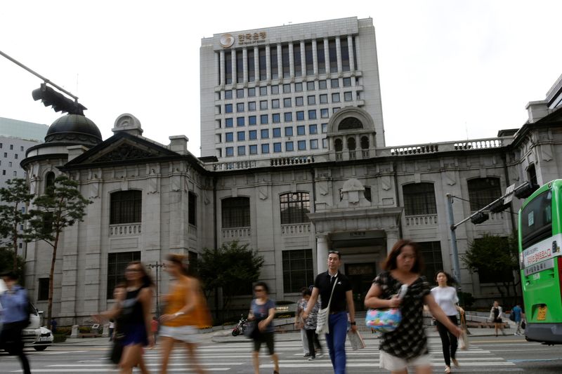 &copy; Reuters. People walk on a zebra crossing in front of the buliding of Bank of Korea in Seoul, South Korea, July 14, 2016.  REUTERS/Kim Hong-Ji/FILE PHOTO