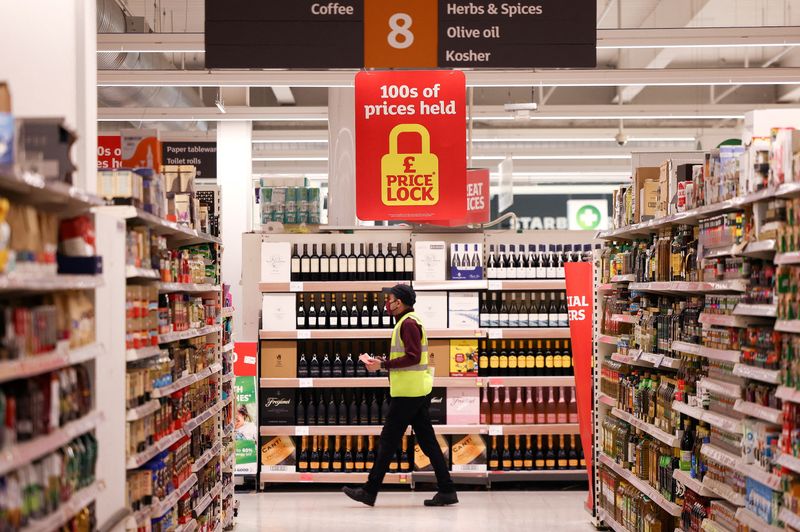 &copy; Reuters. FILE PHOTO: A employee walks inside a Sainsbury’s supermarket in Richmond, west London, Britain, June 27, 2022.  Picture taken June 27, 2022. REUTERS/Henry Nicholls/File Photo