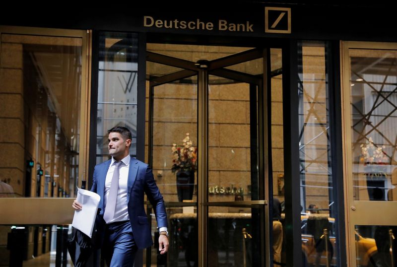 &copy; Reuters. A man holding an envelope walks out of the lobby of the U.S. headquarters of Deutsche Bank in New York City, U.S., July 8, 2019. REUTERS/Andrew Kelly    