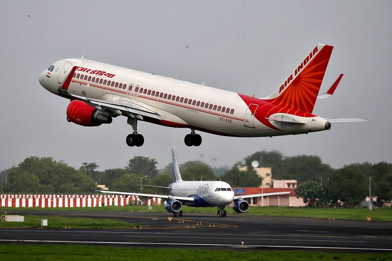 &copy; Reuters. FILE PHOTO: An Air India Airbus A320-200 aircraft takes off as an IndiGo Airlines aircraft waits for clearance at the Sardar Vallabhbhai Patel International Airport in Ahmedabad, India, July 7, 2017/ File Photo