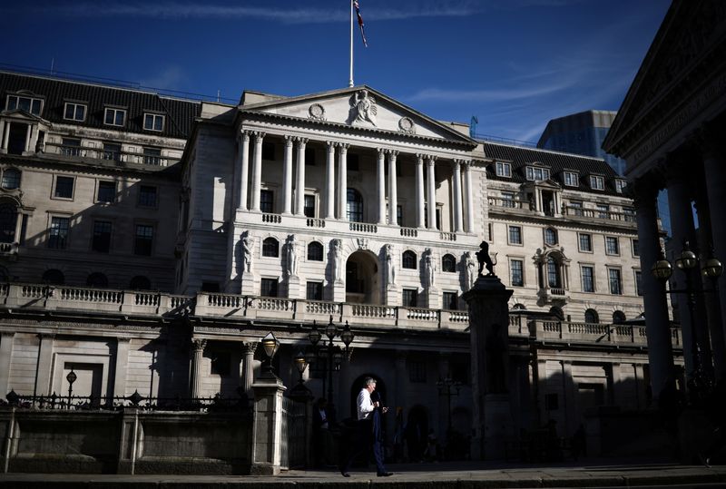 &copy; Reuters. FILE PHOTO-A person walks outside the Bank of England in the City of London financial district in London, Britain May 11, 2023. REUTERS/Henry Nicholls