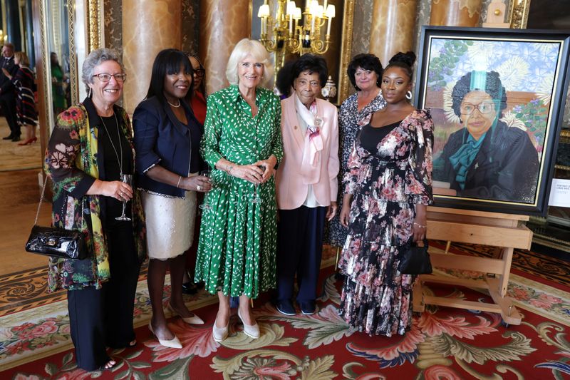 &copy; Reuters. Britain's Queen Camilla poses Linda Haye and her family with during a reception to mark the 75th anniversary of the arrival of HMT Empire Windrush to British shores, at Buckingham Palace on June 14, 2023 in London, Britain. During the reception to celebra