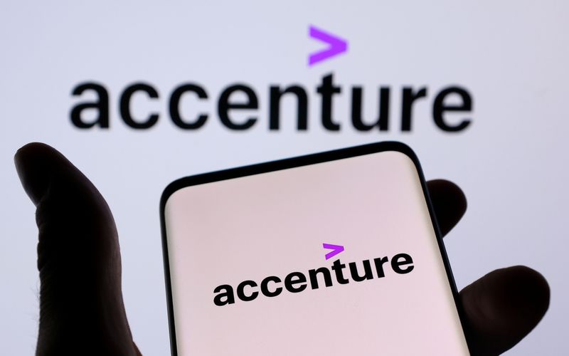 &copy; Reuters. FILE PHOTO: Accenture PLC logo is seen on a smartphone in front of displayed same logo in this illustration taken, December 1, 2021. REUTERS/Dado Ruvic/Illustration