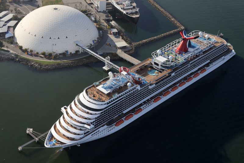 &copy; Reuters. FILE PHOTO: A Carnival cruise ship is docked, amid the coronavirus disease (COVID-19) pandemic, in Long Beach, California, U.S., April 7, 2021. REUTERS/Lucy Nicholson/File Photo