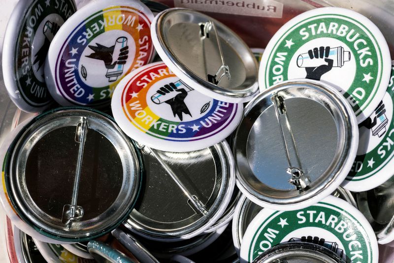 © Reuters. Buttons for Starbucks workers are seen during a rally as part of a collective action over a Pride decor dispute, outside the Starbucks Reserve Roastery in Seattle, Washington, U.S., June 23, 2023. REUTERS/Matt Mills McKnight