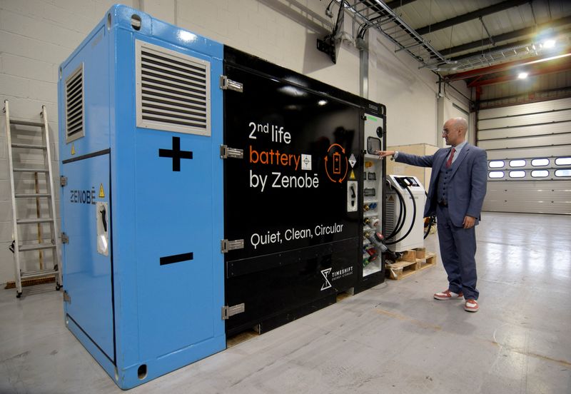 &copy; Reuters. Zenobe's Founder Director Steven Meersman shows off one of the company's second-life battery energy storage units that contains part of a battery pack previously used on an electric bus at the startup's innovation centre in Portsmouth, Britain February 20