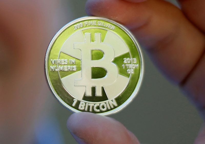 &copy; Reuters. FILE PHOTO: Some of Bitcoin enthusiast Mike Caldwell's coins in this photo illustration at his office in Sandy, Utah, September 17, 2013. REUTERS/Jim Urquhart/File Photo