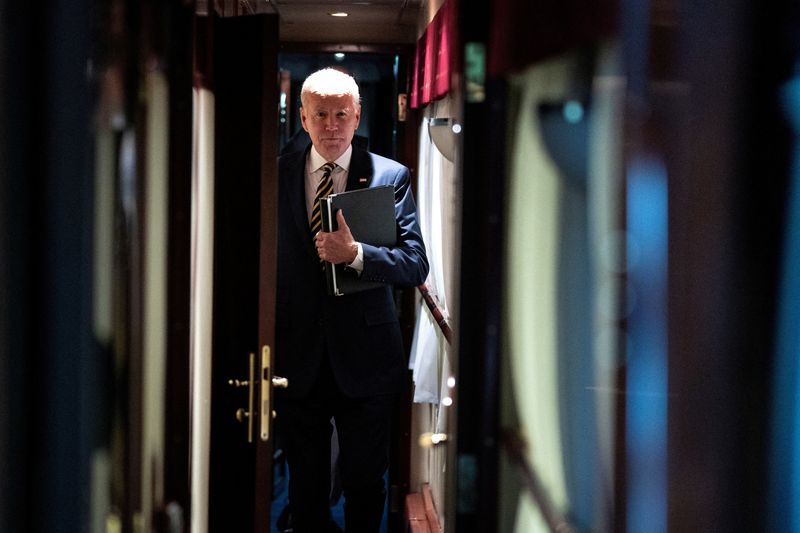 &copy; Reuters. President Joe Biden walks down a corridor to his cabin on a train after a surprise visit with Ukrainian President Volodymyr Zelenskiy, Monday, Feb. 20, 2023, in Kyiv. Biden took a nearly 10-hour train ride from Poland into Kyiv. Evan Vucci/Pool via REUTER