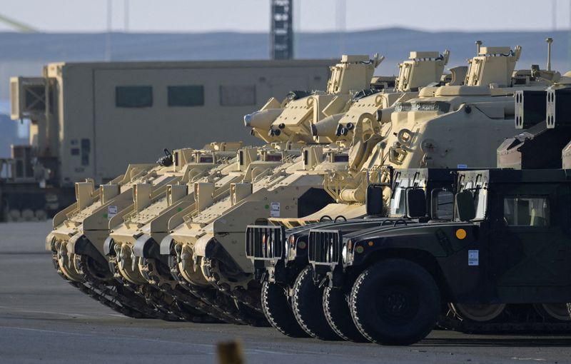 &copy; Reuters. FILE PHOTO: Bradley Fighting Vehicles of the U.S. army get offloaded from cargo vessel ARC Integrity, after their arrival at the harbour in Bremerhaven, Germany, February 10, 2023. REUTERS/Fabian Bimmer/File Photo