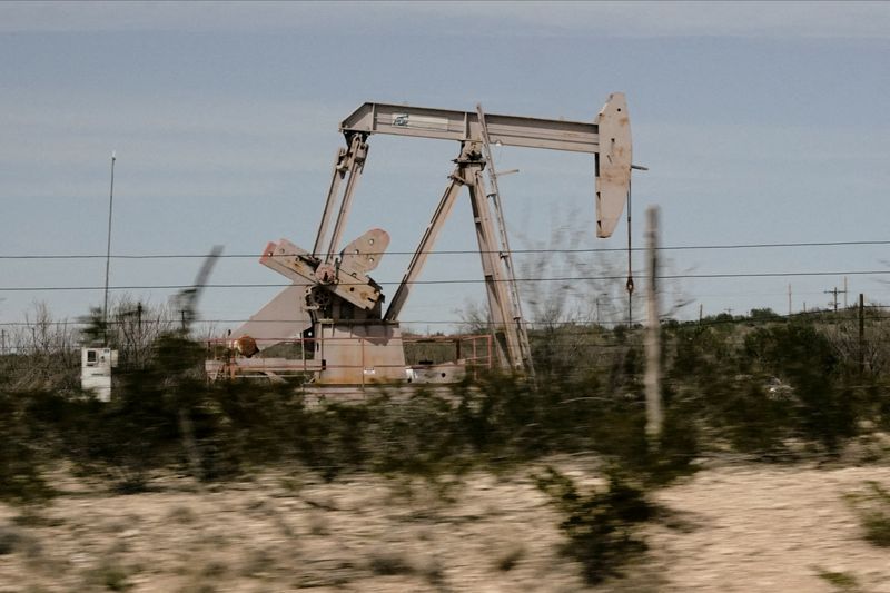 &copy; Reuters. FILE PHOTO: A pump jack drills oil crude from the Yates Oilfield in West Texas?s Permian Basin near Iraan, Texas, U.S., March 17, 2023. Picture taken through glass. REUTERS/Bing Guan/File Photo
