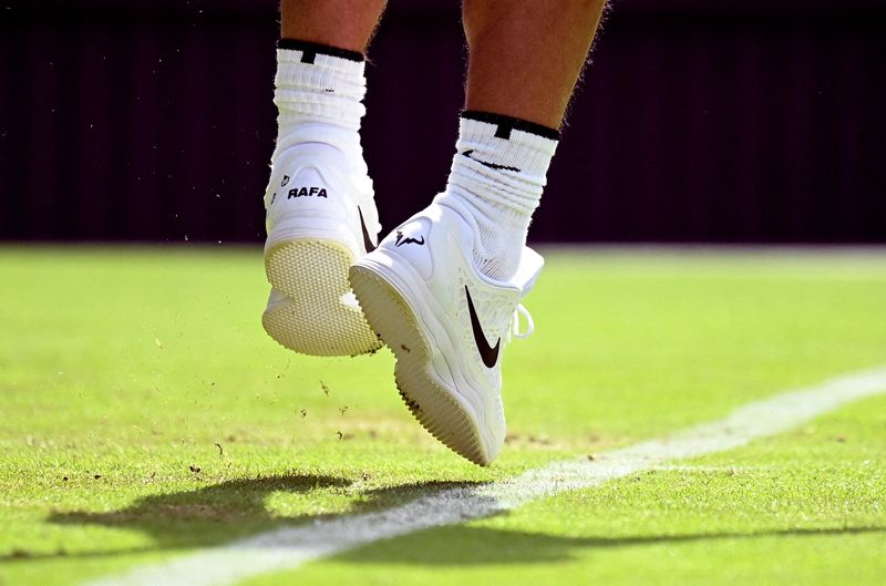 &copy; Reuters. FILE PHOTO: Tennis - Wimbledon - All England Lawn Tennis and Croquet Club, London, Britain - June 28, 2022 The Nike shoes of Spain's Rafael Nadal are seen during his first round match against Argentina's Francisco Cerundolo REUTERS/Toby Melville