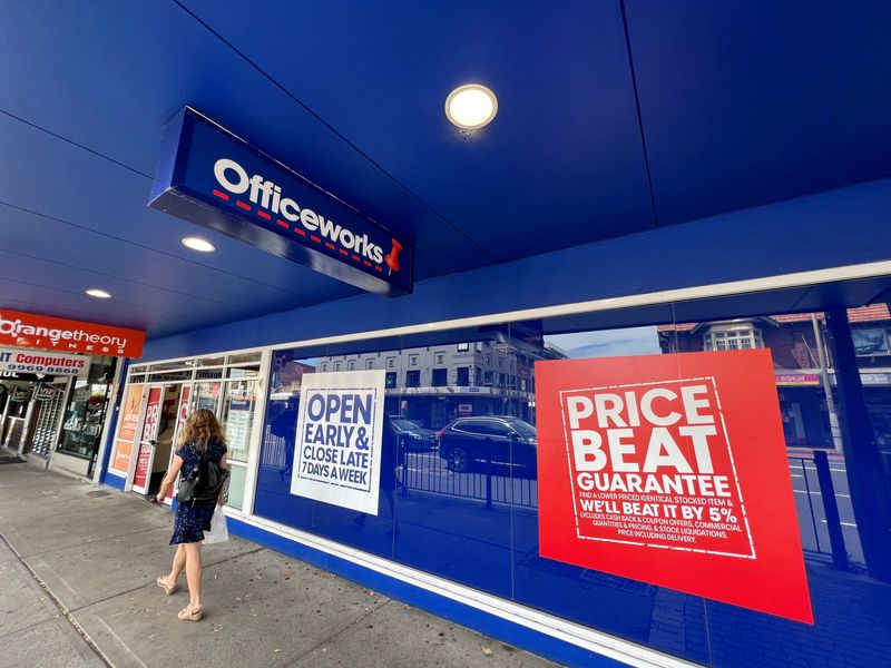 &copy; Reuters. FILE PHOTO: A woman walks past an Officeworks store, part of the Wesfarmers retail conglomerate, in Sydney, Australia February 17, 2022. REUTERS/Stephen Coates/File Photo