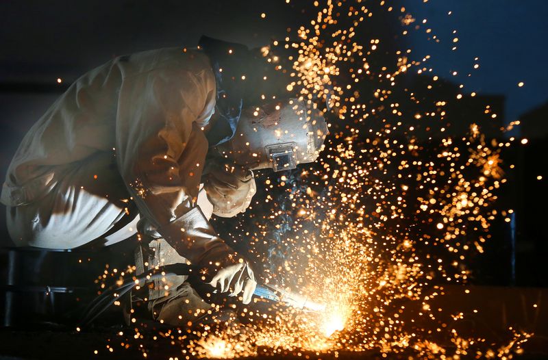 &copy; Reuters. A worker works on a production line at a factory of a ship equipments manufacturer, in Nantong, Jiangsu province, China March 2, 2020.  China Daily via REUTERS 