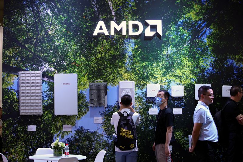 &copy; Reuters. FILE PHOTO: People stand at the AMD booth during the Mobile World Congress in Shanghai, China June 28, 2023. REUTERS/Nicoco Chan/File Photo