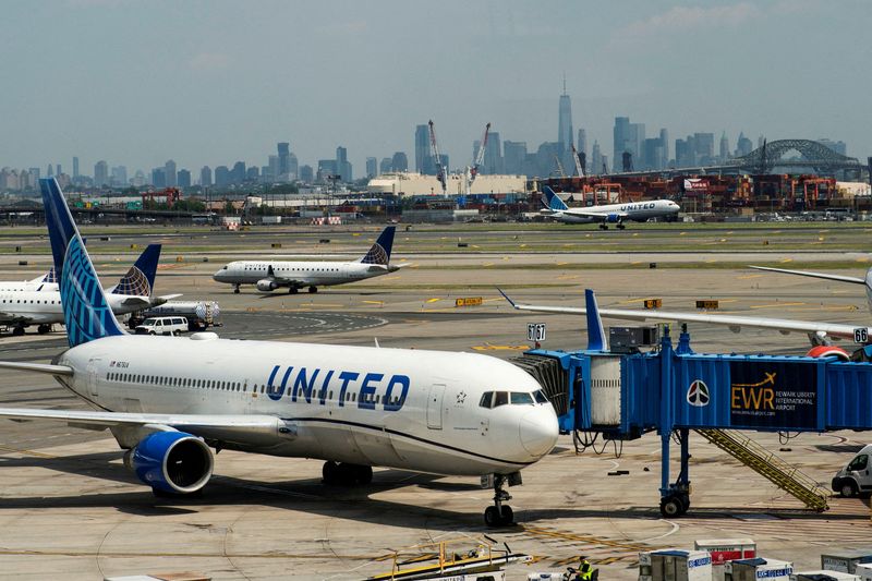 &copy; Reuters. The One World Trade Center and the New York skyline are seen while United Airlines planes use the tarmac at Newark Liberty International Airport in Newark, New Jersey, U.S., May 12, 2023. REUTERS/Eduardo Munoz/File Photo